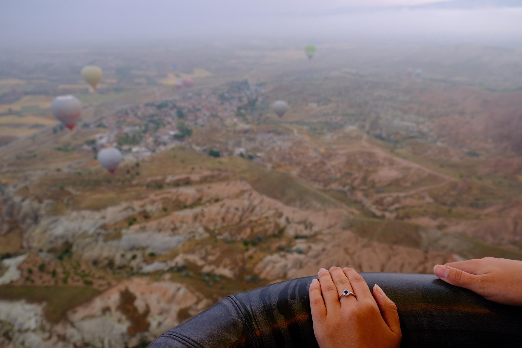 engagement ring on a ballon basket over Kappadokya
